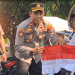 Kobar Nasionalisme Jelang HUT Ke-81 RI, Polsek Kediri Kota Bagikan Ratusan Bendera untuk Ojol dan Tukang Becak